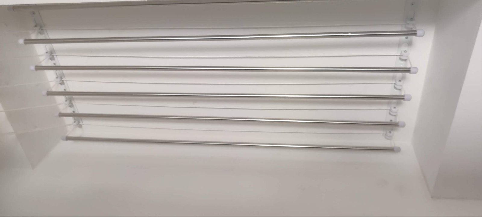 Ceiling cloth hanger pulley and rod adjustment by Perfect Screens Hyderabad