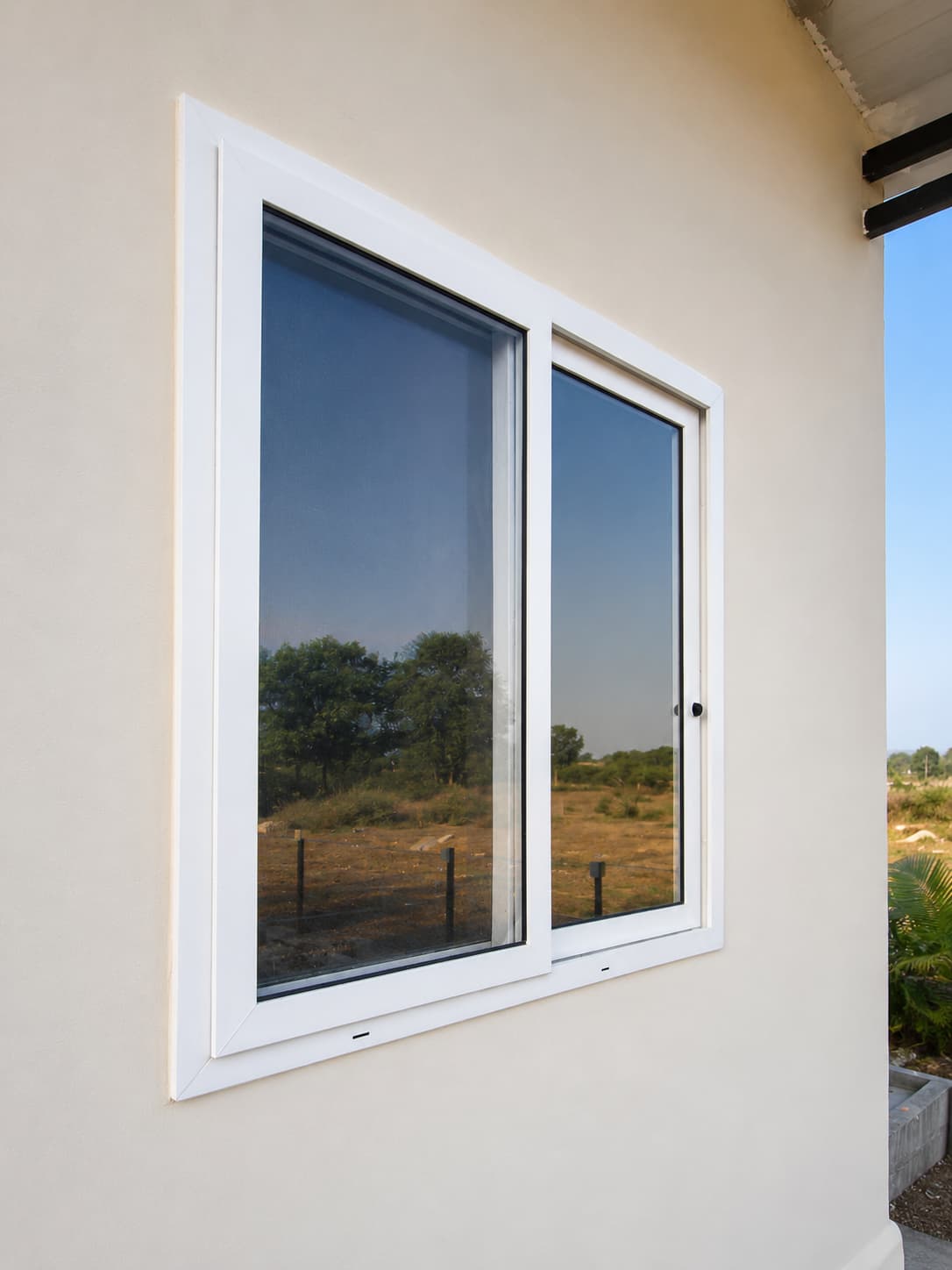 White UPVC sliding window installed near Chintal and IDPL Hyderabad
